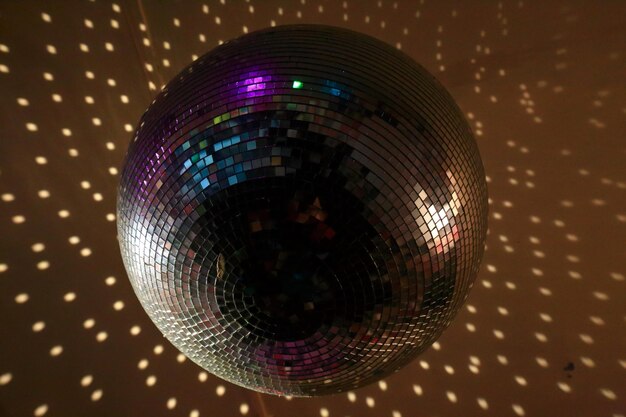 Low angle view of disco ball hanging from nightclub