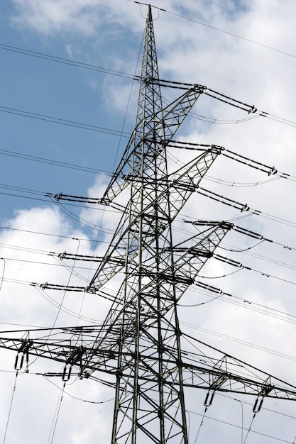 Low angle view of electricity pylon against sky