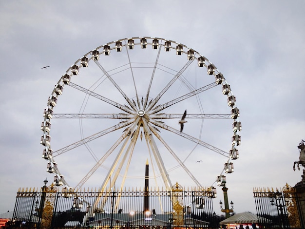 Low angle view of ferris wheel against sky