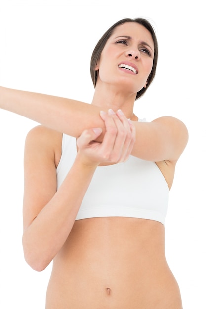 Low angle view of a fit woman with elbow pain