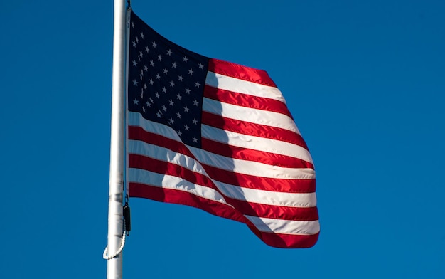 Low angle view of flag against clear sky