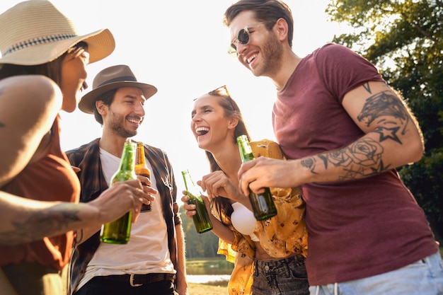 Low angle view of friends with beer glass