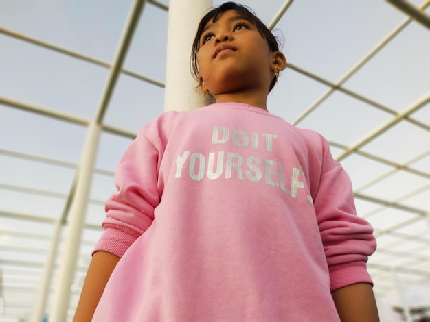 Low angle view of girl looking away