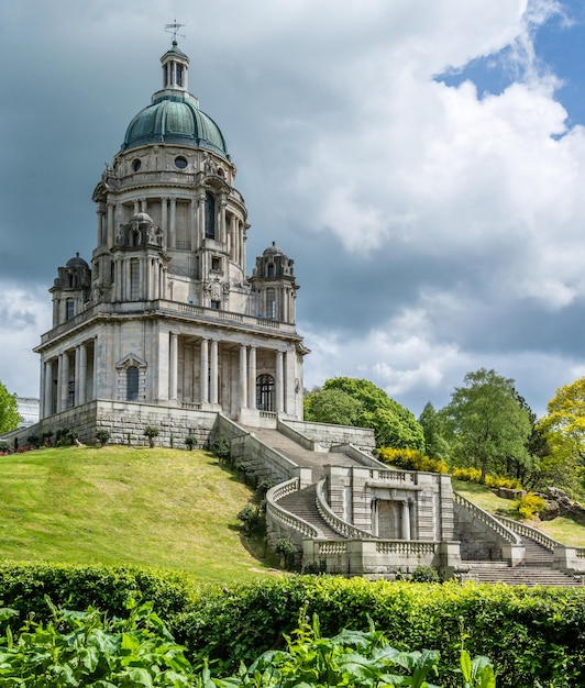 Low angle view of historic building against cloudy sky