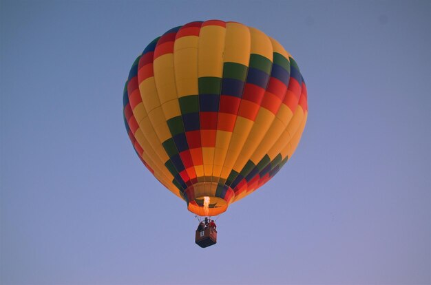 Low angle view of hot air balloon against clear sky during sunset