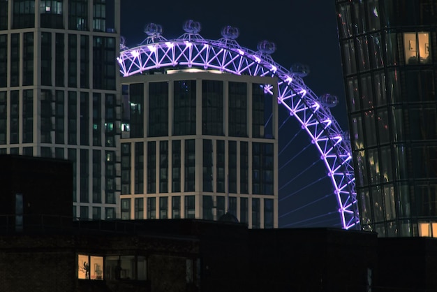 Low angle view of illuminated building against sky at night