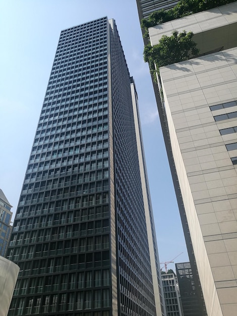 Photo low angle view of modern buildings against sky in city