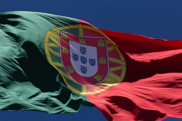 Photo low angle view of portuguese flag