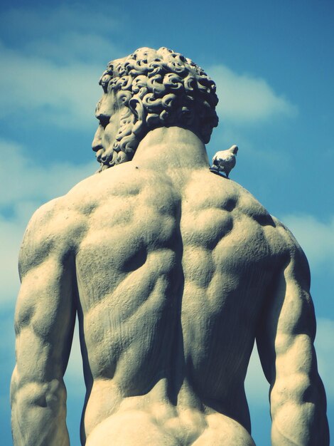 Low angle view of statue against sky