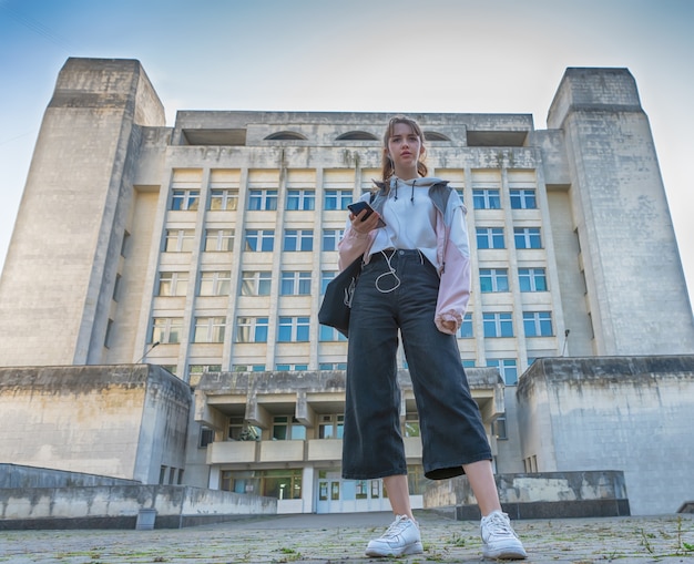 Low angle view of a trendy young college student