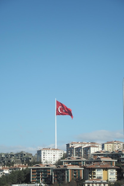 Low angle view of turkish flag against sky