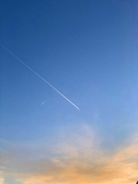 Low angle view of vapor trails in sky