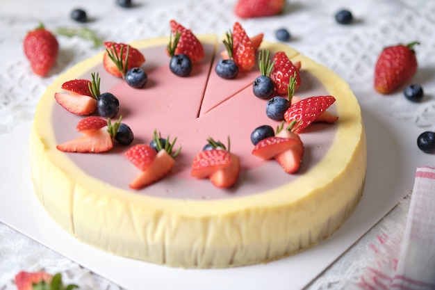 Low Fat Mousse Yogurt Strawberry and Raspberry Cheesecake set on cafe table.  Gluten Free Low-Carb Healthy Dessert.