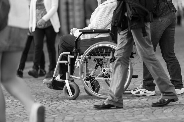 Photo low section of people walking on street