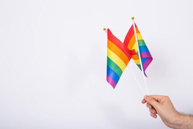 Photo low section of person holding umbrella against white background