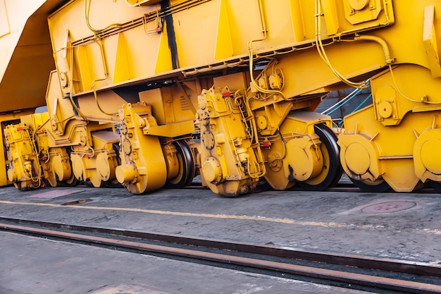 The lower part of the port crane chassis on rails