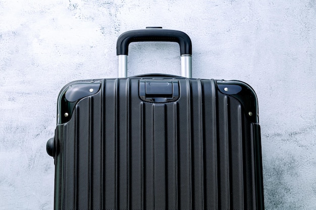 Luggageblack suitcase set on a white background top view image flat laying element Minimal travel