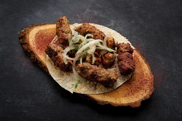 Lula kebab with grilled mushrooms