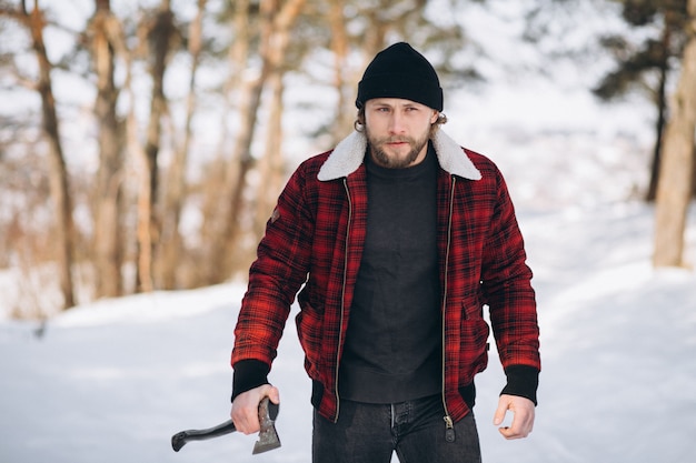 Lumberjack with ax in the woods