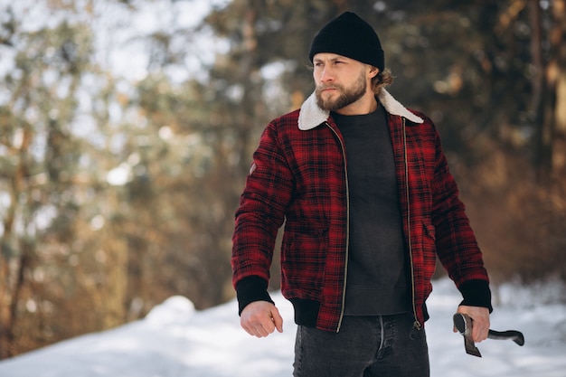 Lumberjack with ax in the woods