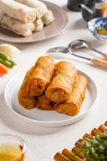 Lumpia or popiah are made of thin paperlike or crepelike pastry skin called lumpia wrapper