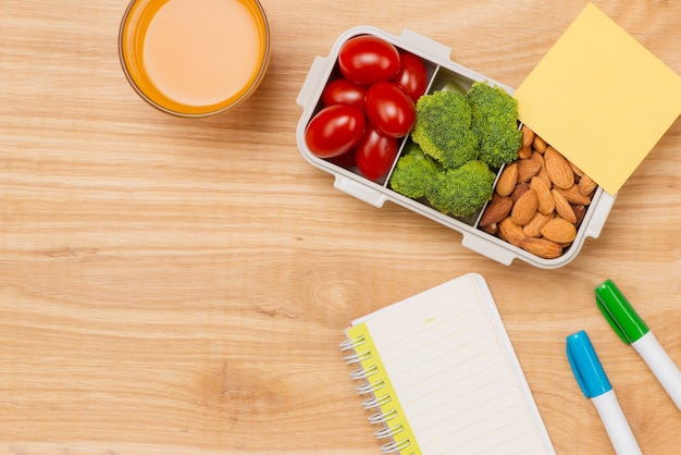 Lunch box and healthy food on isolated background