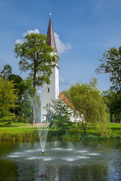 Lutheran Church of St Berthold and pond in the foreground Sigulda Latvia