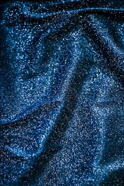 Luxe glowing texture night club branding and new years party concept  blue holiday sparkling glitter abstract background luxury shiny fabric material for glamour design and festive invitation