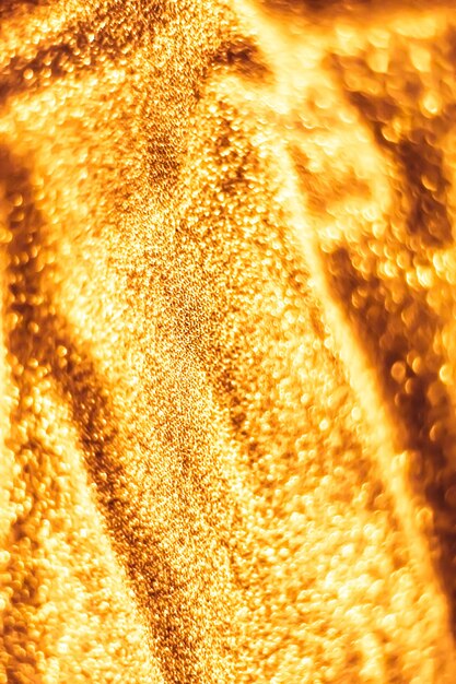 Luxe glowing texture night club branding and new years party concept  golden holiday sparkling glitter abstract background luxury shiny fabric material for glamour design and festive invitation