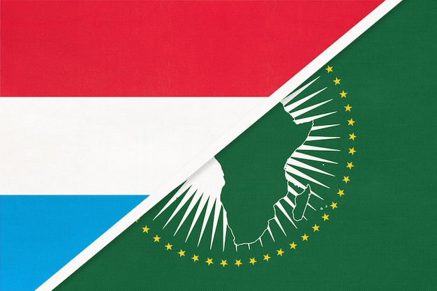 Luxembourg and African Union national flag from textile Africa continent vs Luxembourgish national flags