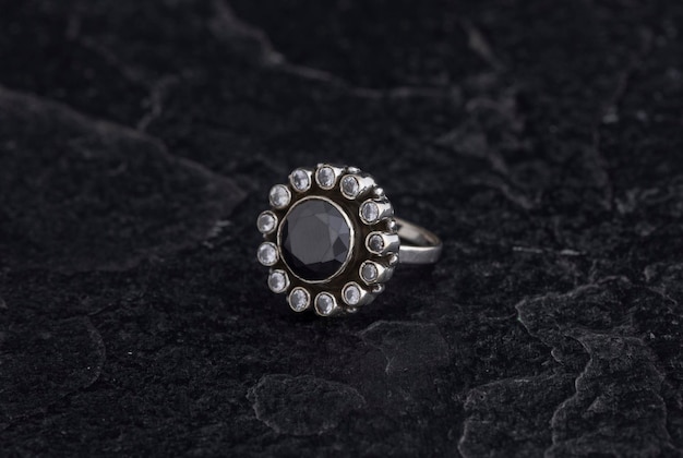 Luxury 925 Sterling Silver Ring on Vintage Black Background