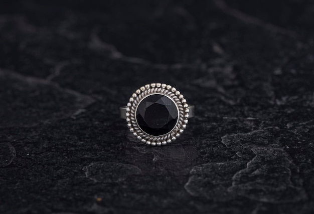 Luxury 925 Sterling Silver Ring on Vintage Black Background