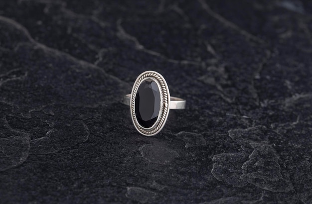 Luxury 925 Sterling Silver Ring on Vintage Black Background