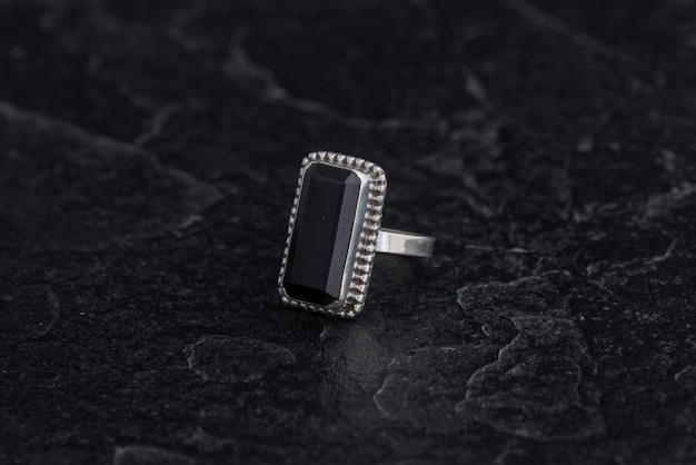 Luxury 925 Sterling Silver Ring on Vintage Black Background