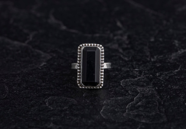 Luxury 925 Sterling Silver Ring on Vintage Black Background