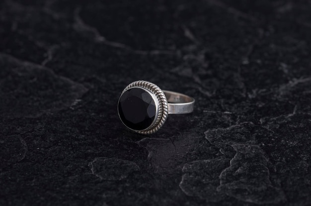 Luxury 925 Sterling Silver Ring on Vintage Black Background