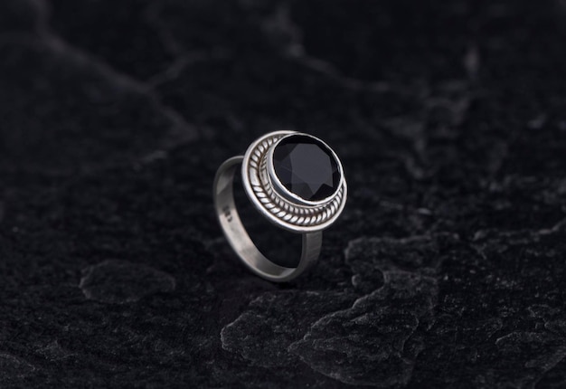 Luxury 925 Sterling Silver Ring on Vintage Black Background