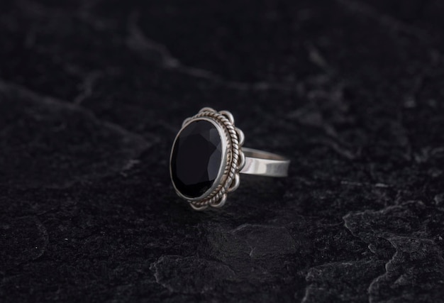 Luxury 925 Sterling Silver Ring on Vintage Black Background