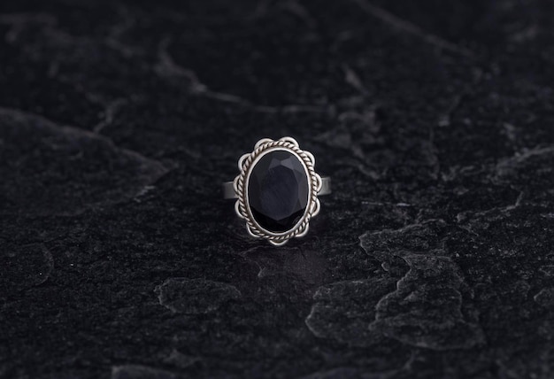 Luxury 925 Sterling Silver Ring on Vintage Black Background