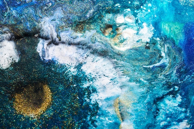 Luxury abstract background liquid art Blue alcohol ink with golden paint streaks water surface marble texture