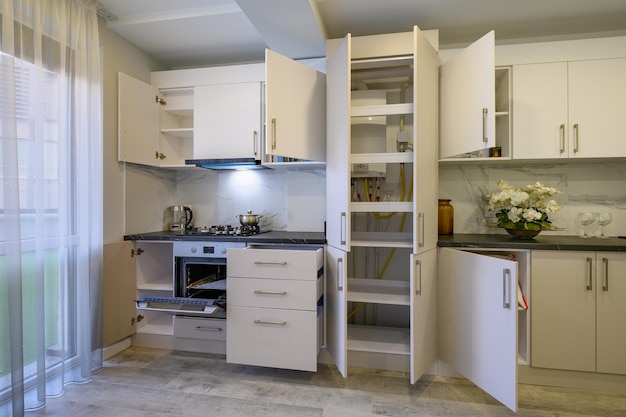 Luxury beige and cream kitchen interior details some drawers retracted