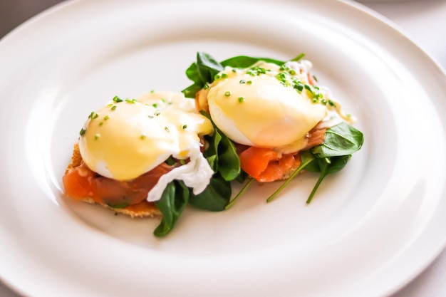 Luxury breakfast brunch and food recipe poached eggs with salmon and greens on glutenfree toast for restaurant menu and gastronomy