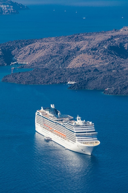 Luxury cruiser in Fira Bay, coastline of Santorini Greece. Famous Europe travel destination sea bay