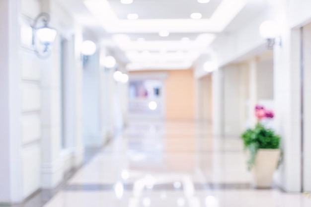 Luxury department store shopping mall interior abstract defocused blur with bokeh background concept of shopping seasons design