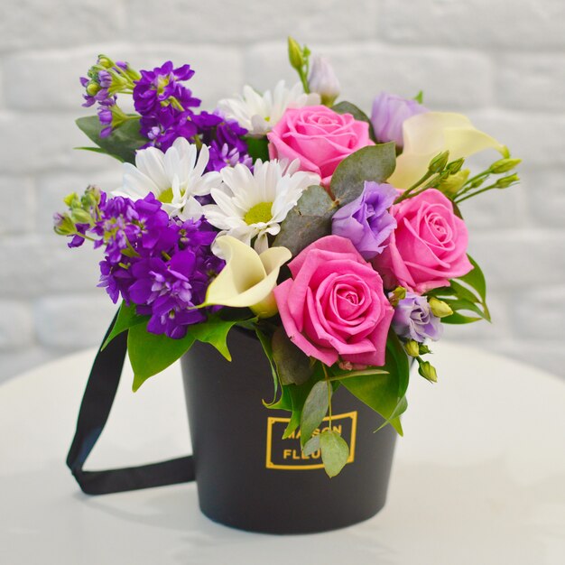 Luxury floral arrangement. Flowers in a box. Romantic blooming gift.