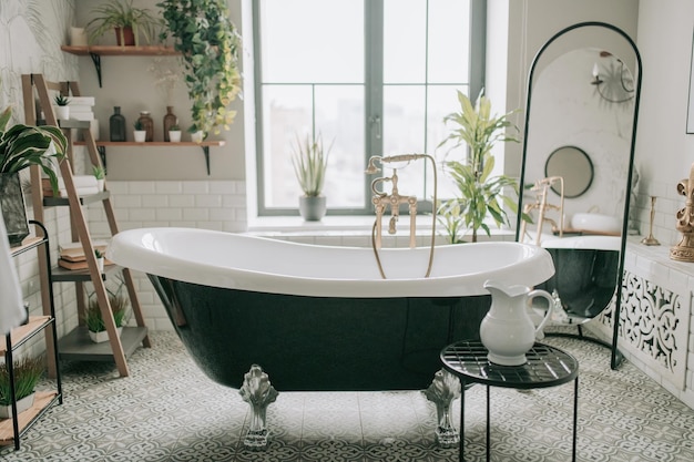 Luxury interior of eco style modern bathroom with oval bathtub and accessories at natural lighting