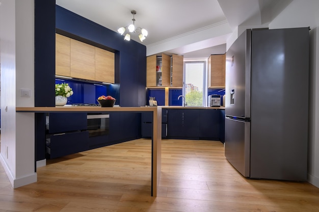 Luxury large blue and wood colored kitchen