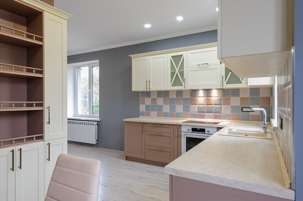 Luxury modern provence styled grey, pink and cream kitchen interior