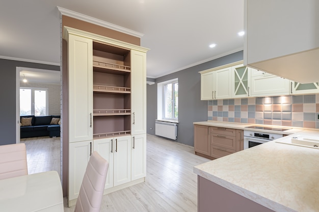 Luxury modern provence styled grey, pink and cream kitchen interior