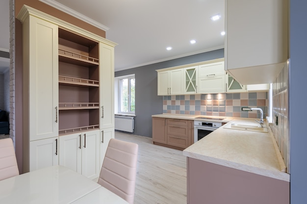 Luxury modern provence styled grey, pink and cream kitchen interior